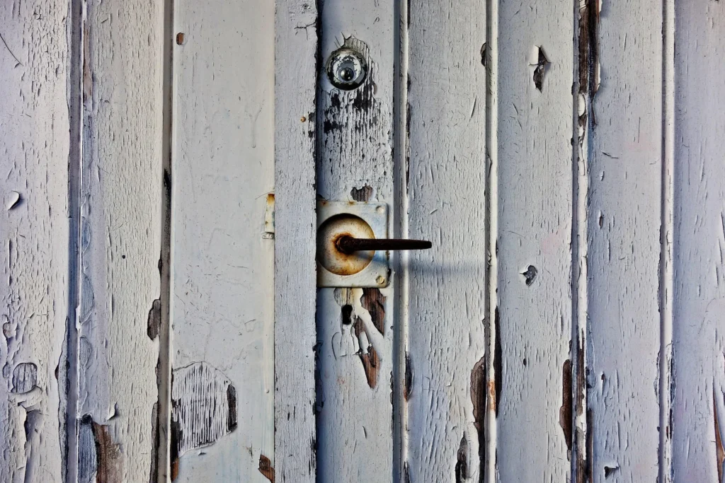 weathered wood garage door restoration tallahassee
